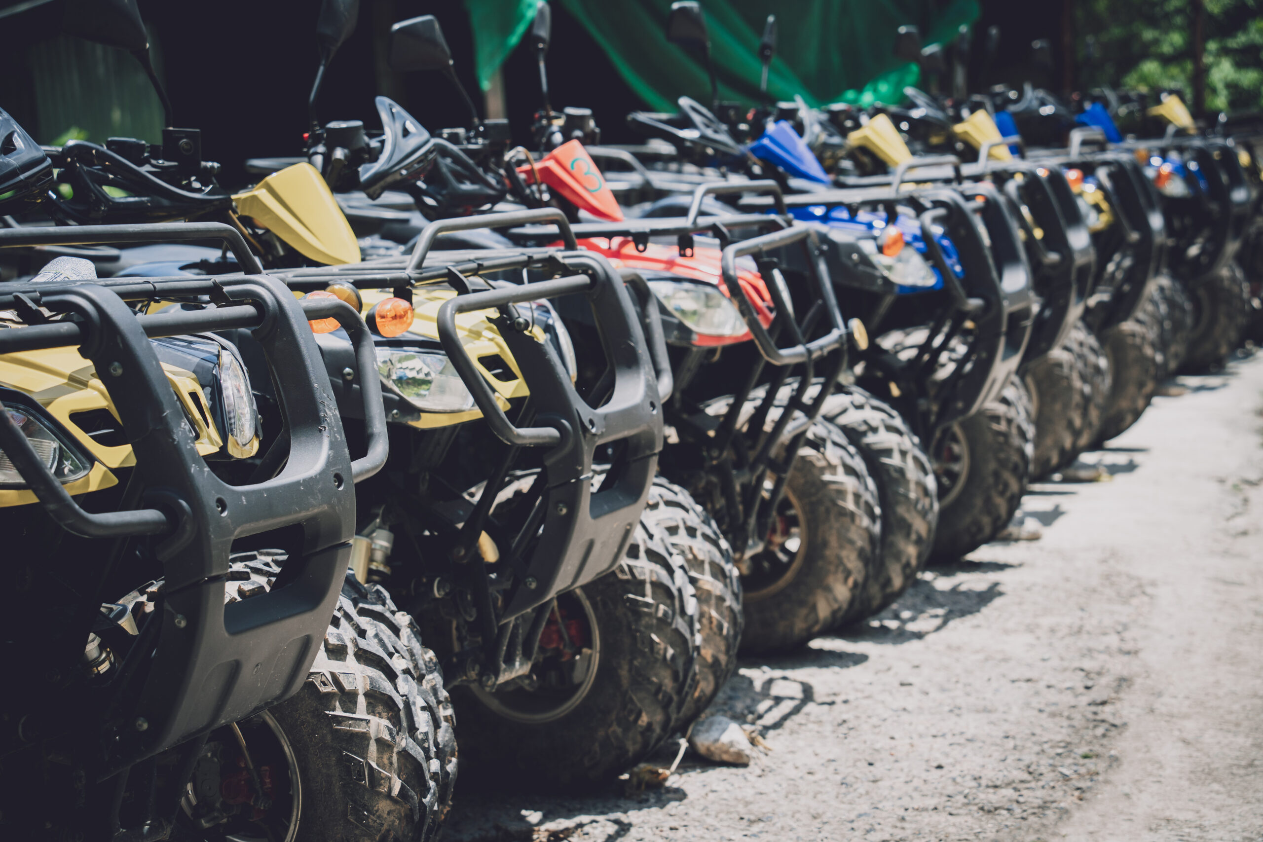 View of row dirty ATVs quad bike.